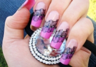 beautiful female hand with stunning frills nail art design manicure holding a silver hair clip