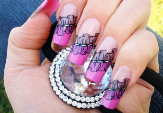 beautiful female hand with stunning frills nail art design manicure holding a silver hair clip